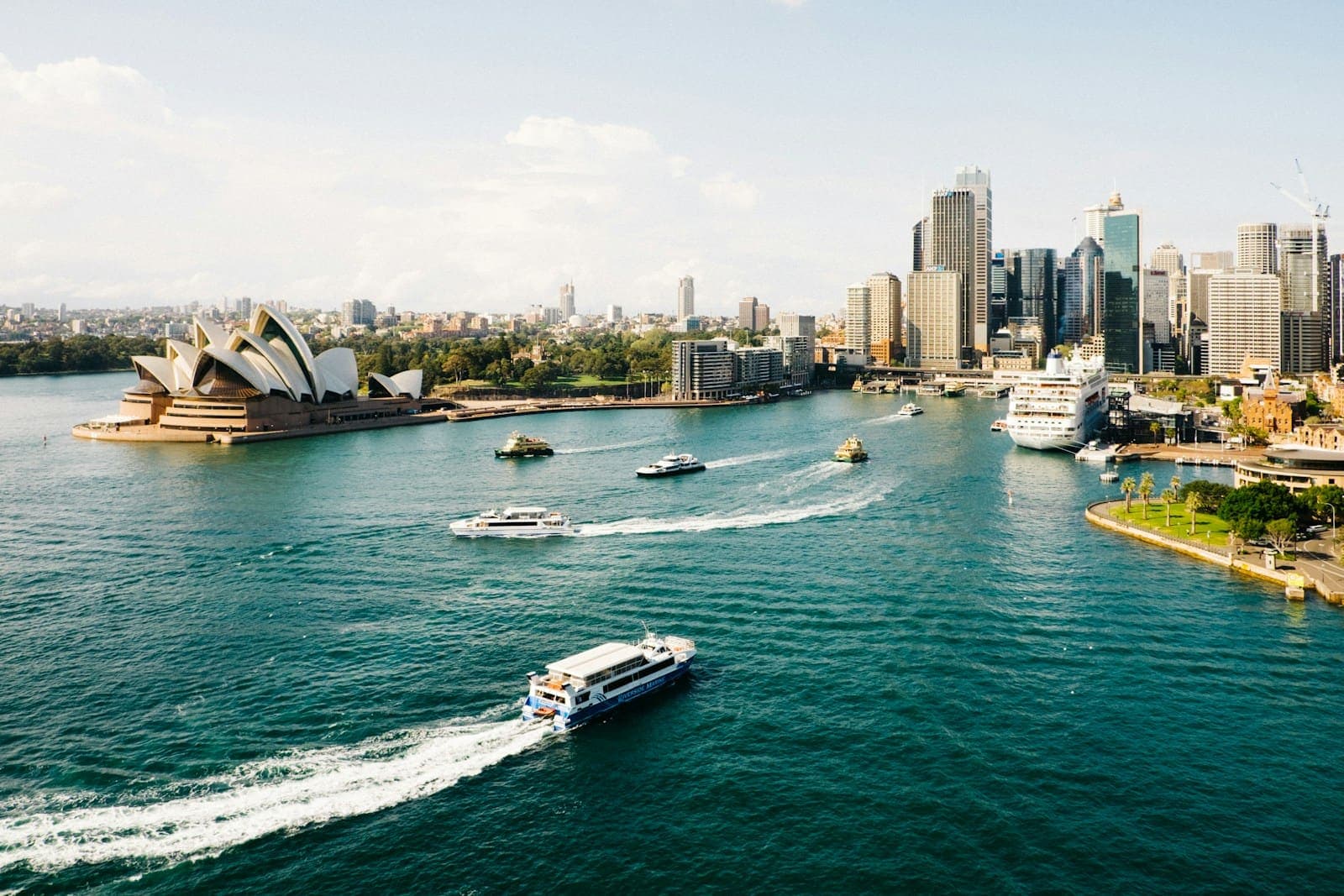 Sydney Harbour with the Opera House and city towers on a sunny day